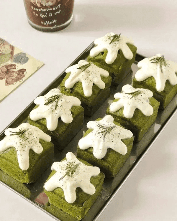 Several pieces of Matcha Mini Pound Cake served on a tray.