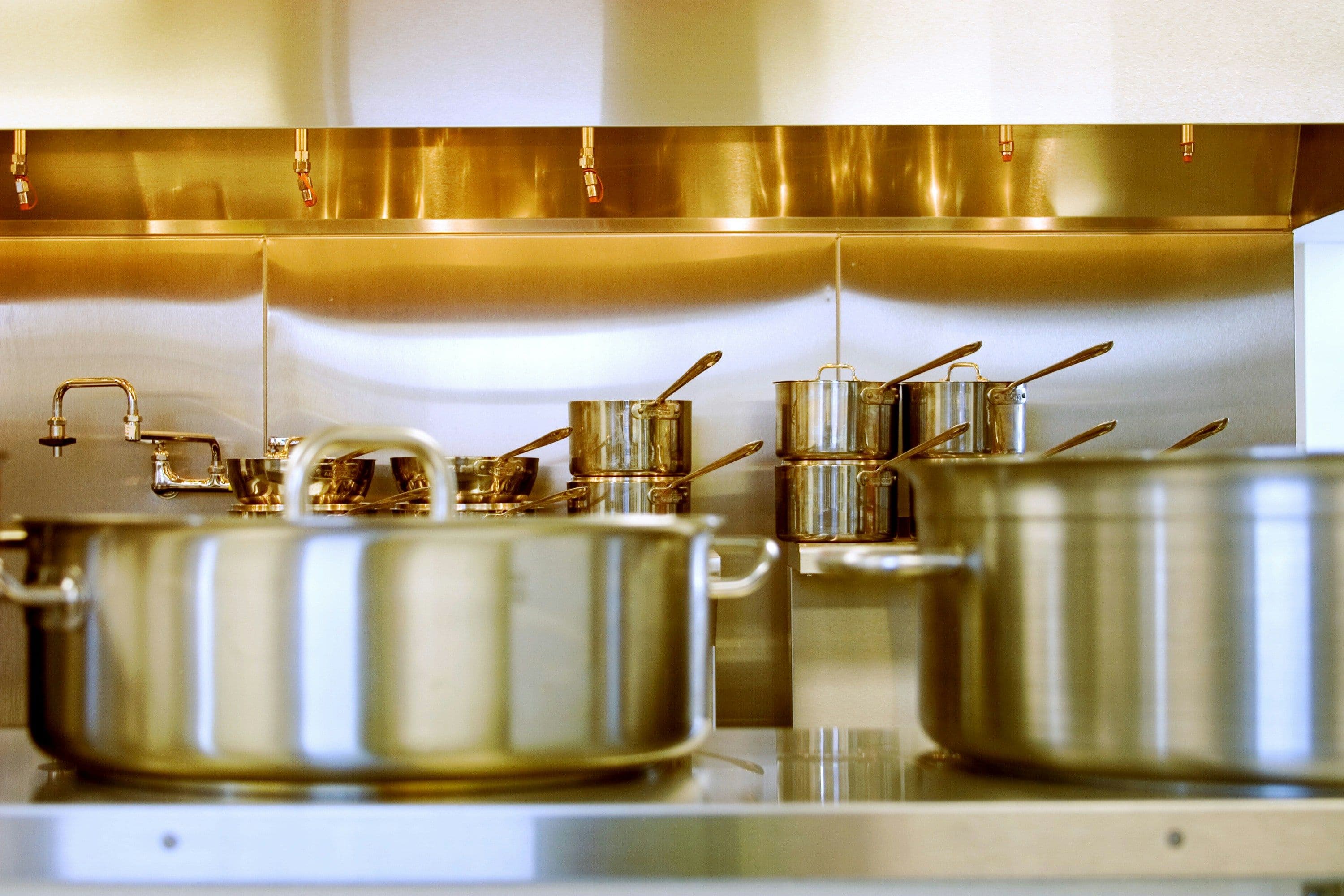 Several stainless steel utensils placed beside each other.